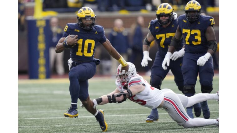 USC heads to Michigan with ‘healthy respect’ for reigning champs – and QB Alex Orji